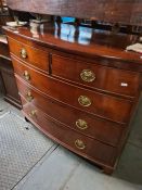 A Georgian mahogany bow front chest having two short and three long drawers