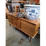 A vintage 1970s sideboard by Alfred Cox for AC Furniture having three central drawers 152.5cms