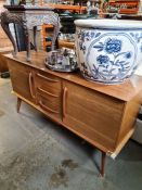 A vintage 1970s sideboard by Alfred Cox for AC Furniture having three central drawers 152.5cms