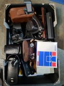 A tray of old cameras, binoculars and similar