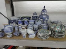 A large selection of oriental china, including lidded vases, cups, plates and bowls, etc