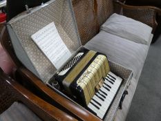 A Hohner piano accordion in case