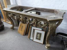 A carved with swags and tails and central masked design hallway table and hardstone top
