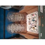 A selection of thimbles and glass domed display cases
