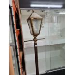 A vintage brass plated standard lamp in form of Victorian lantern