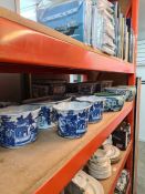 A quantity of modern oriental style blue and white items, mainly bowls and plant pots