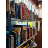 Two shelves of military and transport related books