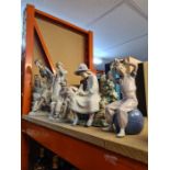 A large Nao figure of lady leading on rocks, 2 other Nao figures and sundry
