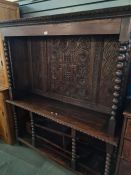 A made up Oak bookcase/sideboard having 18th Century carved back decorated flowers, with similarly a
