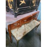 An antique mahogany bow fronted side table having three drawers on square legs