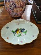 A Meissen hand-painted shell shaped dish decorated fruit and butterflies, 31.5cms