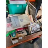 A box of ephemera consisting of vintage postcards, books, birthday cards, etc