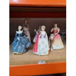 Four Royal Doulton lady figures, one signed by Michael Doulton, and one Nao figure