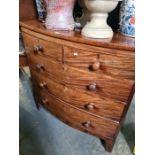 An antique mahogany bow front chest having two short and three long drawers on bracket feet, 100.5cm