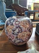 A modern Cloisonne enamel ginger jar having allover decoration of Cranes and flowers, height 23cms