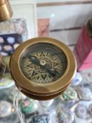 Navigating compass and magnifier