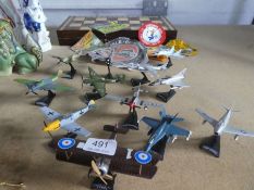 A selection of model aircraft on stands, a selection of pennants and a chess board