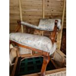 A pair of semi-upholstered cane arm chairs, with a matching coffee table