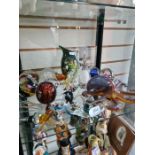 A shelf of glass to include an Octopus, a Mdina Stingray and paperweights