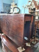 An antique mahogany two flap table on turned legs, a mahogany hanging corner cupboard having glazed