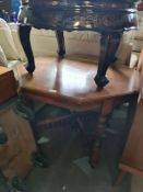 A late Victorian octagonal occasional table having pierced 'X' stretcher, 88.5cms