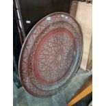 A large wall hanging, copper decorative plaque, in Islamic style