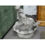 A seated Cherubian clamshell water feature, possibly lead