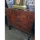 An 18th Century chest having two short and two long drawers on later stand