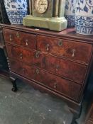 An 18th Century chest having two short and two long drawers on later stand