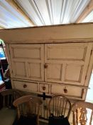 A shabby chic style painted kitchen cupboard having 3 drawers