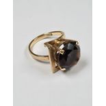 9ct yellow gold dress ring of asymetric form, set with large round cut smokey topaz in raised claw m