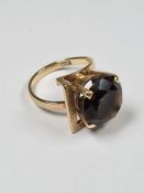 9ct yellow gold dress ring of asymetric form, set with large round cut smokey topaz in raised claw m