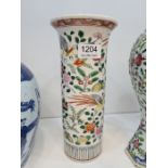 A Chinese cylindrical vase with flared rim, the body decorated flowers and birds, 25.5cms