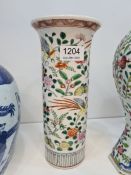 A Chinese cylindrical vase with flared rim, the body decorated flowers and birds, 25.5cms