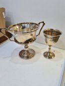 A silver two handled trophy cup having raised circular pedestal foot, hallmarked Birmingham 1932, G.