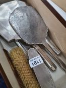 Silver dressing table items to include two brushes, a comb and a hand mirror by William Neale and So