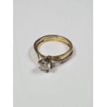 18ct two tone solitaire diamond ring, with approx 0.5 carat diamond in 6 claw mount in crossover des