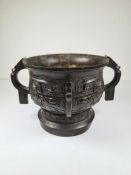 A small Chinese Archaistic bronze Gui, a ceremonial cup, decorated two large Taotie masks, the centr