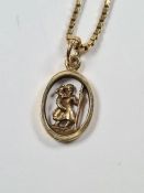 9ct yellow gold box chain, 45cm hung with a 9ct yellow gold oval pendant framing a figure holding a