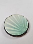 A pretty silver enamel compact having turquoise ombre guilloche enamel (slight damage to one side),
