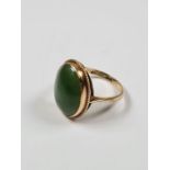 9ct yellow gold dress ring set with large oval Cabouchon green hardstone, size P/Q