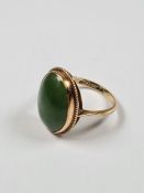 9ct yellow gold dress ring set with large oval Cabouchon green hardstone, size P/Q