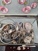 Small box containing silver and white metal jewellery to include bangles, earrings, charms, enamelle