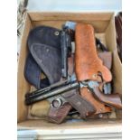 A Webley 'Senior' air pistol, two GAT Guns, a plastic replica Smith and Wesson, a WW2 Canvas holste