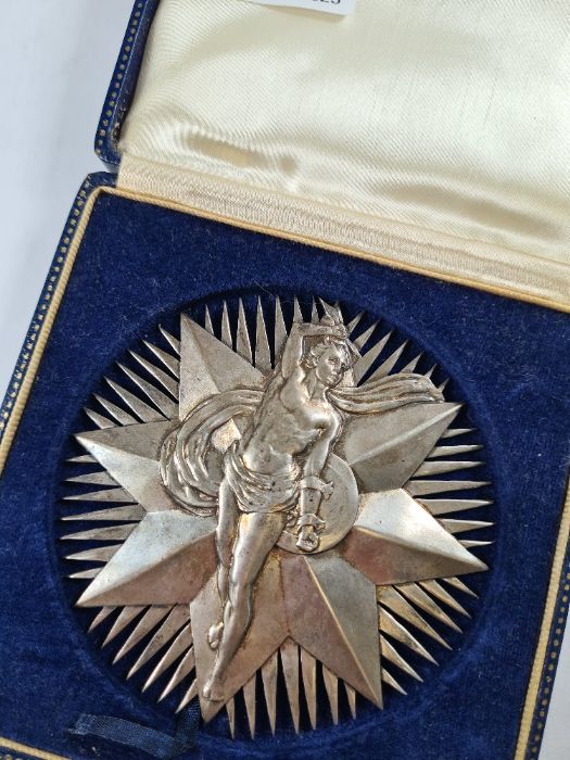 A silver medal by Bravingtons Ltd, Birmingham 1966, of star motif form, having a male figure in reli - Image 2 of 3