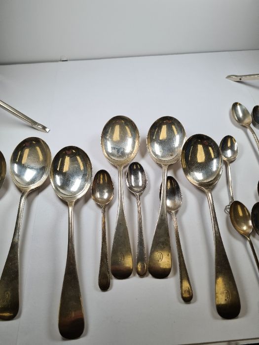 A set of six silver dessert spoons by John Rand and Son Ltd, Sheffield 1929. Also with a set of four