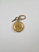 18ct gold cased ladies fob watch, with 18ct gold dustcover, key present, golden dial with floral dec