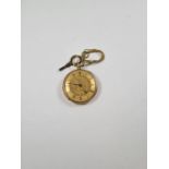 18ct gold cased ladies fob watch, with 18ct gold dustcover, key present, golden dial with floral dec