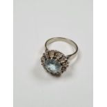 18ct white gold cluster ring with round cut aquamarine surrounded 12 round cut diamonds, aquamarine