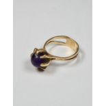 9ct yellow gold attractive dress ring set with an amethyst bead in 8 claw mount, on split design rin